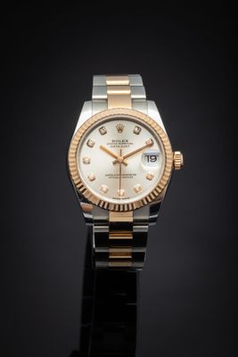 rolex lady datejustr with champagne dial and diamond bezel