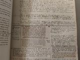 a book open on a table with some writing on it