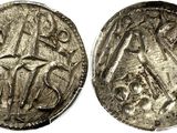 a silver coin with an image of a man and a woman on it