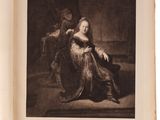 an old black and white photo of a woman sitting in a chair