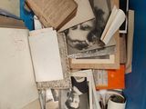 a blue box filled with old books and papers