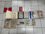 a lot of stamps on the floor next to a book