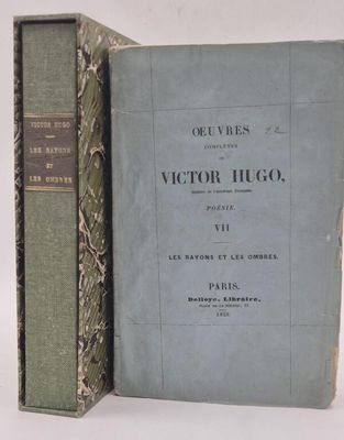 two books that are sitting side by side on a table