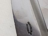 a knife that is laying on a table