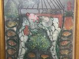 framed painting of a garden scene with flowers and a birdhouse