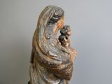 statue of a woman holding a baby in her arms