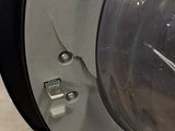 a close up of a clock on the side of a wall