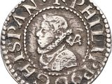 une pièce d'argent portant l'image d'un homme