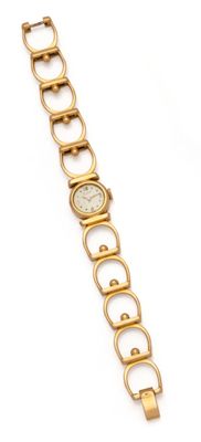 a close up of a gold watch on a white background