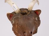 a wooden sculpture of a cow with horns on it ' s head