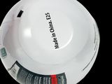 a white plate with a black and red label on it