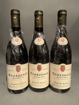 three bottles of wine sitting on top of a table next to each other