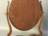 a wooden table with a mirror on top of it