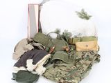 a bag full of military items on a white background