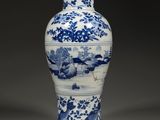 blue and white porcelain vase with a landscape scene on it
