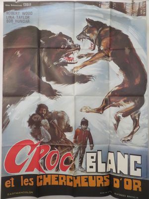 une vieille affiche de cinéma représentant un ours attaquant un homme dans la neige
