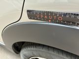 a close up of a car with a measuring tape on it ' s bumper