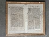 an old book with a picture of a cross on it