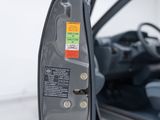 a close up of a car door handle with a sticker on it
