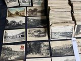 a lot of old postcards that are on a table