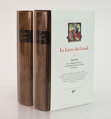 two books sitting on top of each other on a white surface