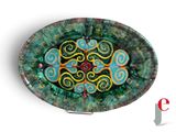 a picture of a decorative glass plate with swirl designs on it