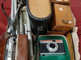 a box with a camera, a case, and other items on it