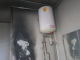 a water heater that is on the wall of a building