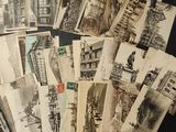 a lot of old postcards that are on the table