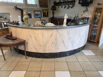a marble counter in the middle of a room