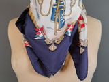 a close up of a mannequin torso with a scarf on it