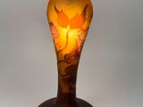 a lamp that is sitting on a table with a bird on it