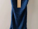 blue dress hanging on a hanger with a tag on it