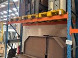 a large metal object on a shelf in a warehouse