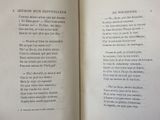 an open book with a poem in it on a table