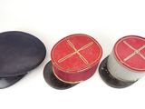 three hats sitting next to each other on a white surface
