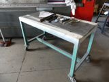 a work table with tools on it in a garage