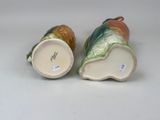 two vases that are sitting on a table