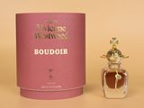 an image of a bottle of perfume sitting next to a pink box