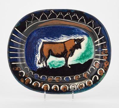 a plate with a picture of a cow on it