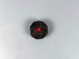 an image of a piece of wood with a red dot on it