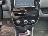 a dashboard of a car with a clock on it