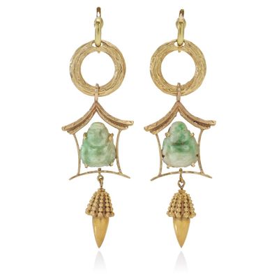 a pair of earrings with green jade and gold details