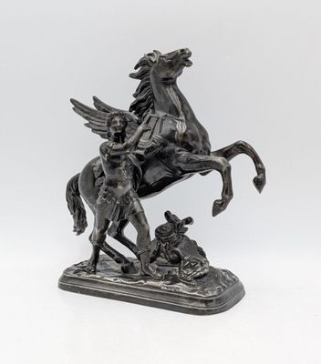 bronze statue of a man on a horse and a woman on a horse