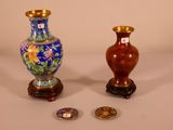 two vases sitting next to each other on a table
