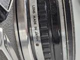 a close up of a camera with a lens attached to it