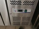 a stainless steel freezer with a digital display on the door