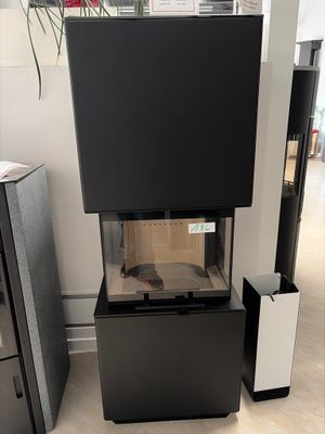 a fish tank sitting on top of a black cabinet