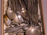 a box with a bunch of silver spoons and spoons
