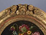 a picture of a painting of flowers in a gold frame